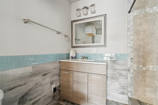 1662 NE 6th St, Moore, OK 73160 - full bath with vanity, a tile shower, and tile walls