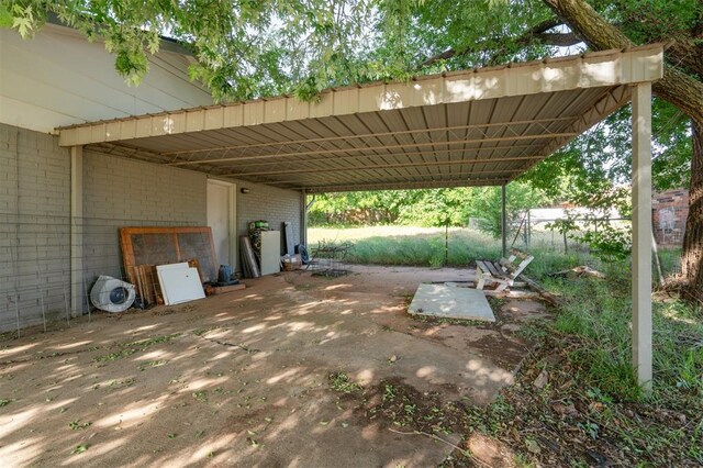 1662 NE 6th St, Moore, OK 73160 - view of car parking with an attached carport