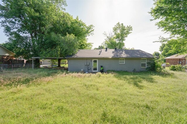 1662 NE 6th St, Moore, OK 73160 - rear view of property with fence