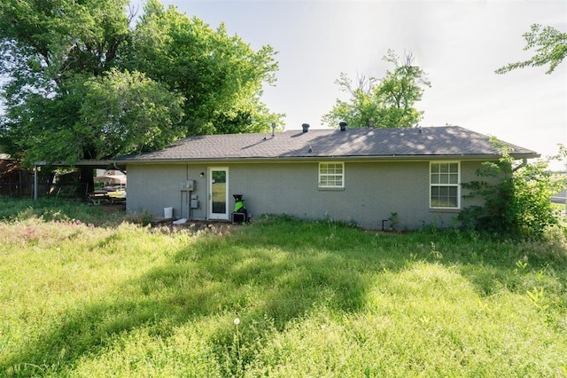 1662 NE 6th St, Moore, OK 73160 - rear view of house with brick siding