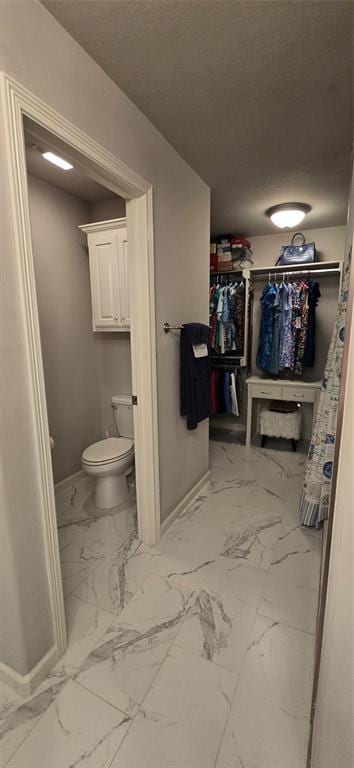 18812 Trailview Way, Edmond, OK 73012 - bathroom with baseboards and marble finish floor