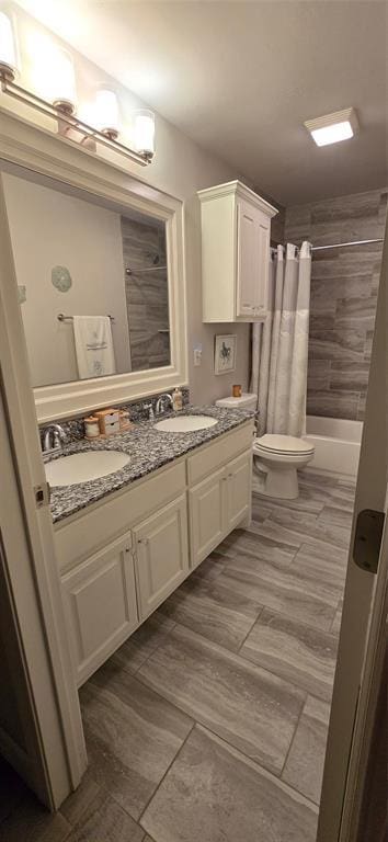 18812 Trailview Way, Edmond, OK 73012 - full bathroom featuring a sink, toilet, double vanity, and shower / tub combo