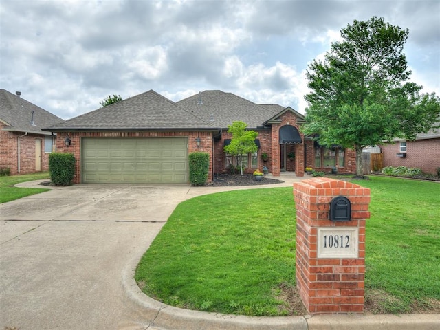 10812 S Miller Ave, Oklahoma City, OK 73170 - view of front of home featuring a front yard, roof with shingles, a garage, and driveway