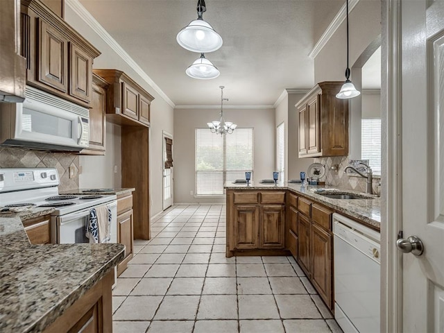 10812 S Miller Ave, Oklahoma City, OK 73170 - kitchen featuring white appliances, a sink, backsplash, a chandelier, and crown molding