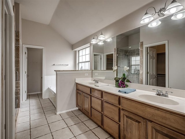 10812 S Miller Ave, Oklahoma City, OK 73170 - full bath featuring tile patterned flooring, a stall shower, vaulted ceiling, a garden tub, and double vanity