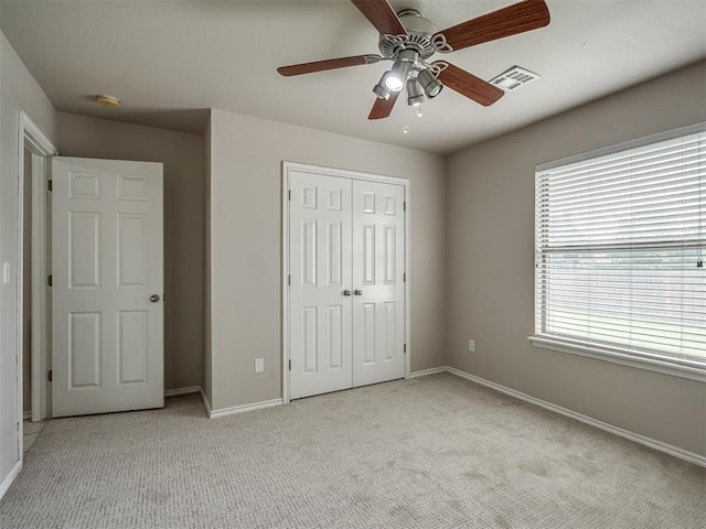 10812 S Miller Ave, Oklahoma City, OK 73170 - unfurnished bedroom featuring light colored carpet, baseboards, and a closet
