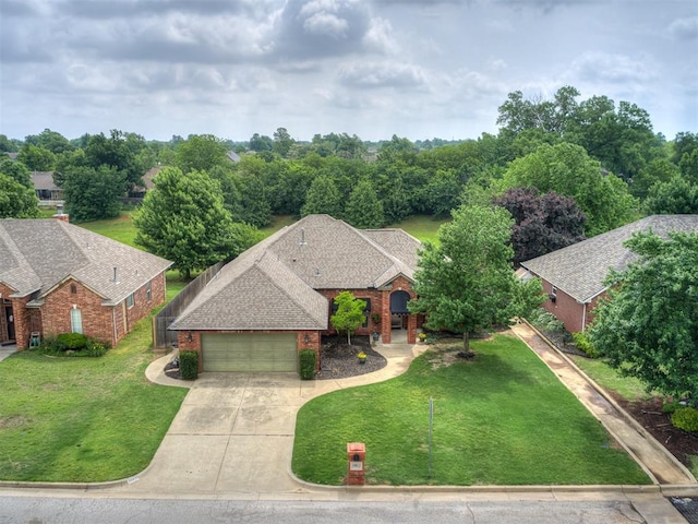 10812 S Miller Ave, Oklahoma City, OK 73170 - view of front of property with brick siding, an attached garage, concrete driveway, and a front yard