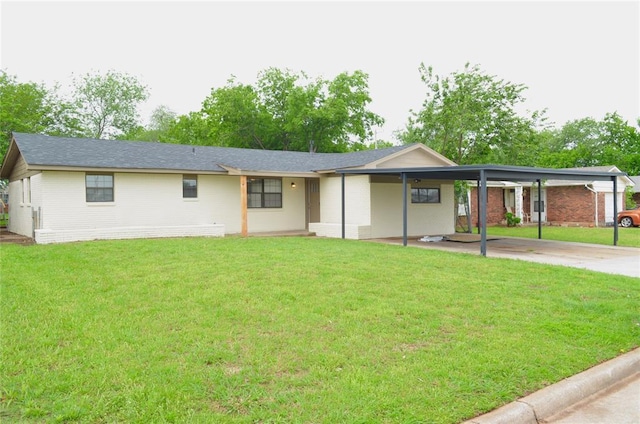 view of front of property with a carport, brick siding, and a front yard