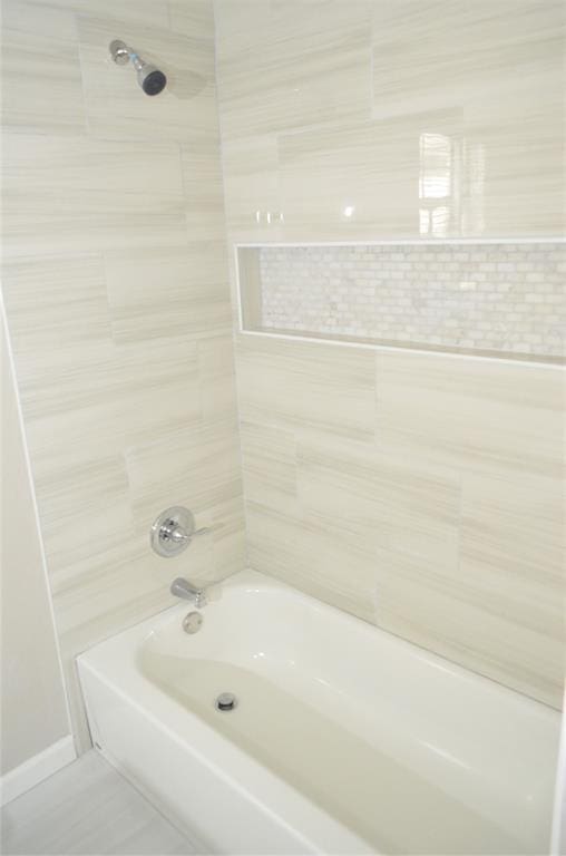 bathroom featuring  shower combination