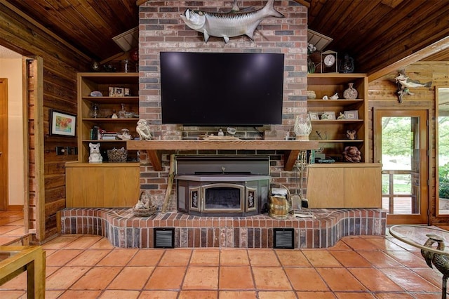 living area with wood walls, wooden ceiling, built in shelves, and lofted ceiling