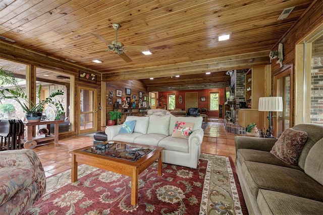 living room with wood ceiling, a ceiling fan, light tile patterned floors, wooden walls, and recessed lighting