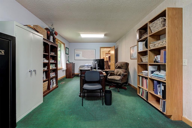 office space with carpet floors, baseboards, and a textured ceiling