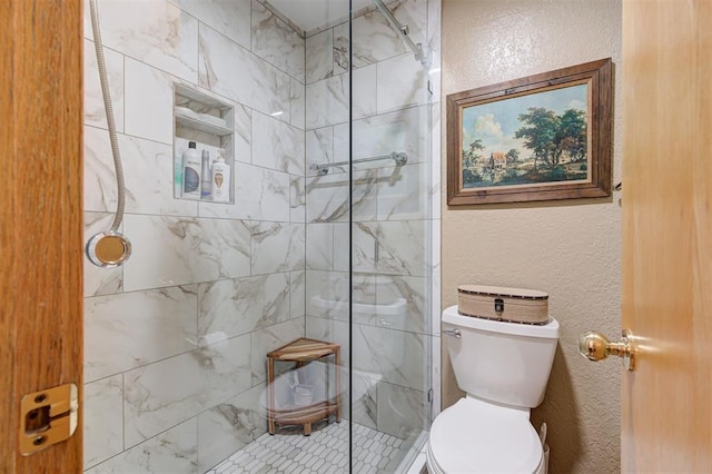full bathroom featuring toilet, a textured wall, and tiled shower