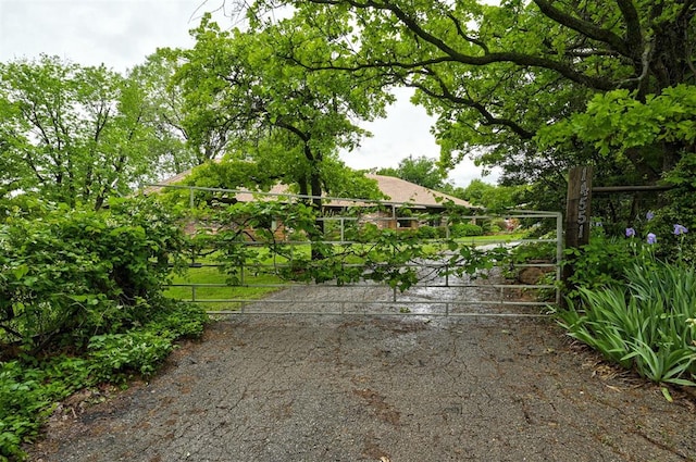 view of gate with fence