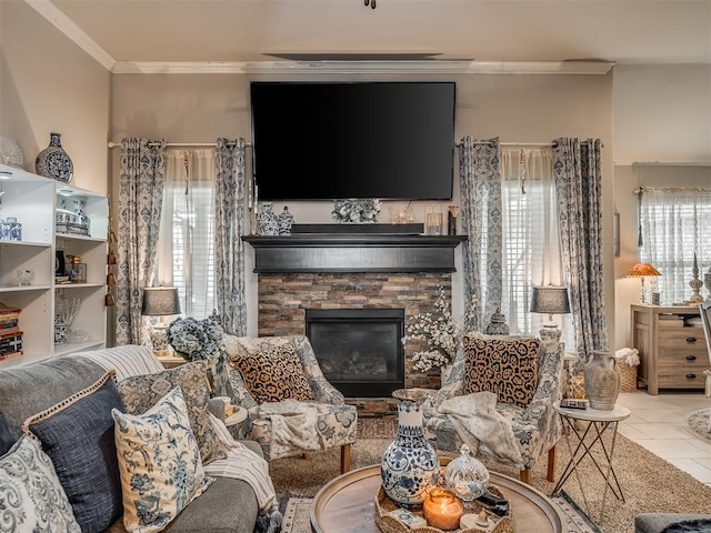 living area featuring a stone fireplace, ornamental molding, and tile patterned flooring