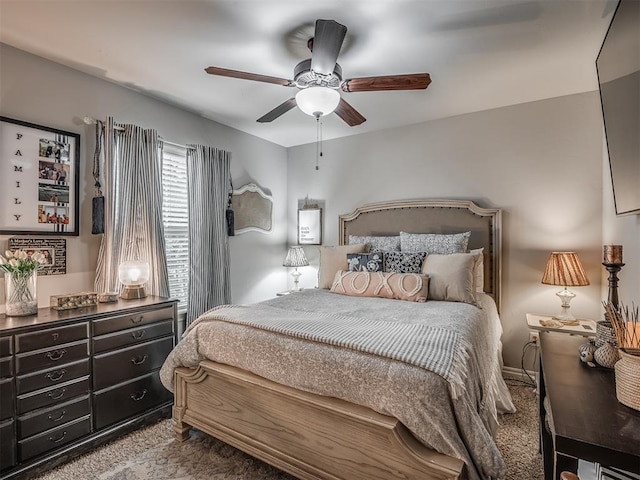 bedroom with ceiling fan and carpet