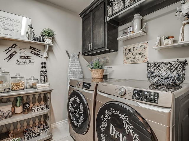 laundry room featuring cabinet space, separate washer and dryer, and baseboards