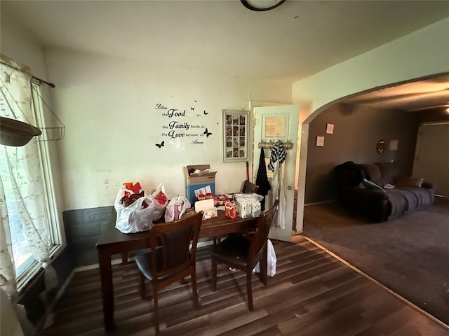 902 S Hitchite St, Wewoka, OK 74884 - dining room featuring arched walkways and dark wood finished floors