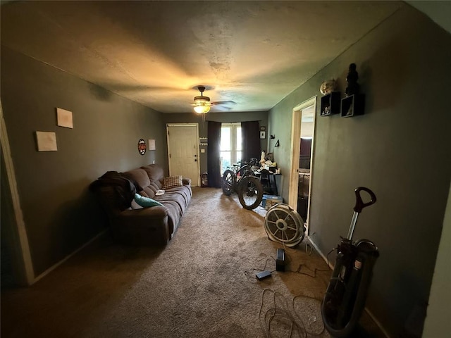 902 S Hitchite St, Wewoka, OK 74884 - living room featuring ceiling fan, carpet floors, and baseboards