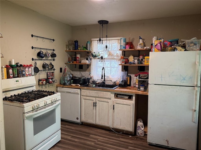 902 S Hitchite St, Wewoka, OK 74884 - kitchen featuring white appliances, a sink, open shelves, and dark wood-type flooring