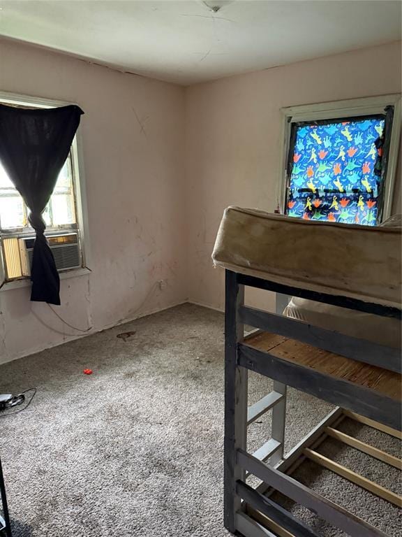 902 S Hitchite St, Wewoka, OK 74884 - unfurnished living room with cooling unit and carpet