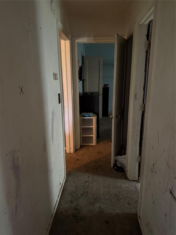 902 S Hitchite St, Wewoka, OK 74884 - hallway with carpet flooring