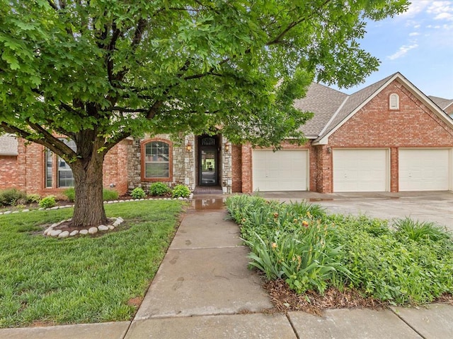 obstructed view of property with a garage, brick siding, a shingled roof, and a front lawn