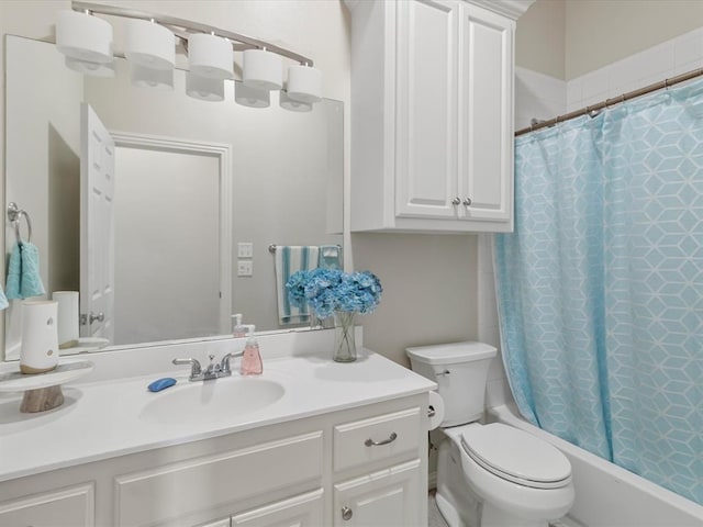 full bathroom featuring vanity, shower / tub combo with curtain, and toilet