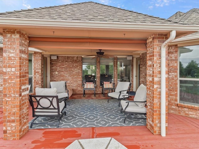 view of patio / terrace with ceiling fan and a deck