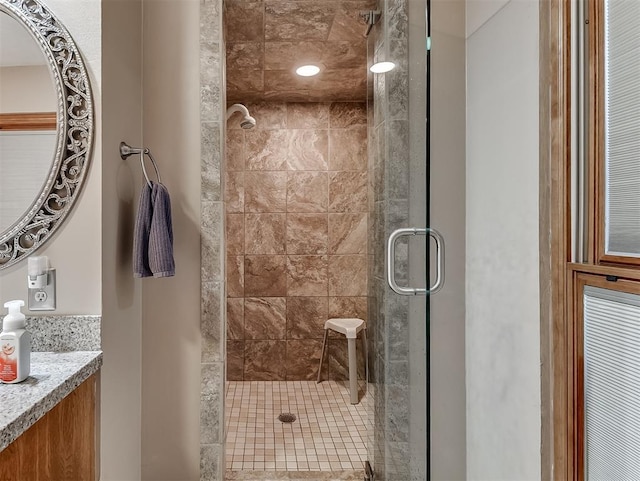 full bath featuring vanity and a stall shower