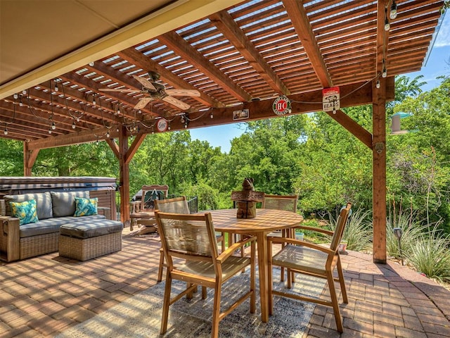 view of patio featuring a pergola, a ceiling fan, outdoor dining area, and an outdoor hangout area