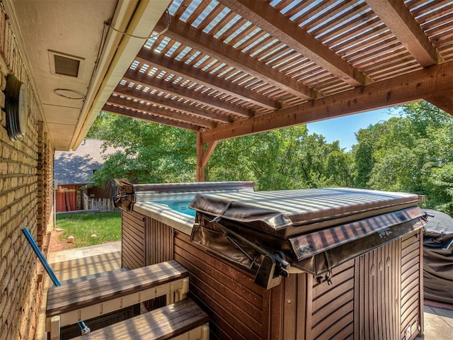 deck with fence and a hot tub