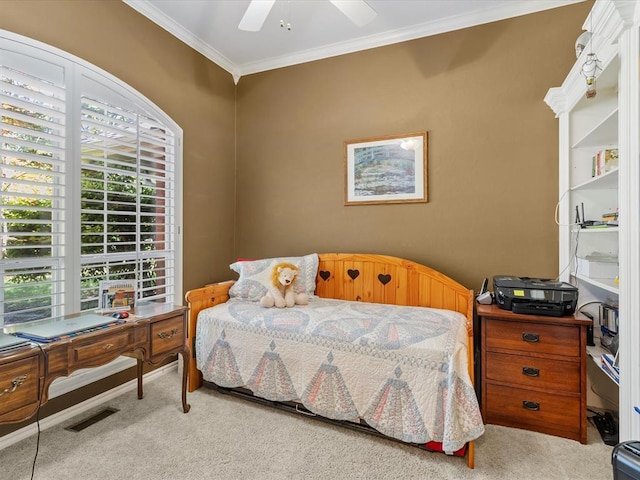 bedroom featuring ornamental molding, carpet, ceiling fan, and visible vents