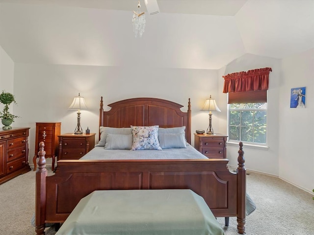 bedroom featuring baseboards, lofted ceiling, and light colored carpet