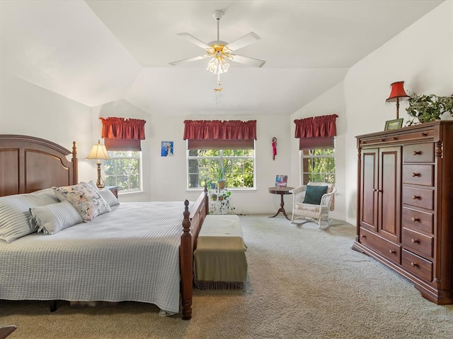bedroom with a ceiling fan, carpet flooring, and lofted ceiling
