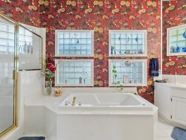 full bath with a healthy amount of sunlight and wallpapered walls