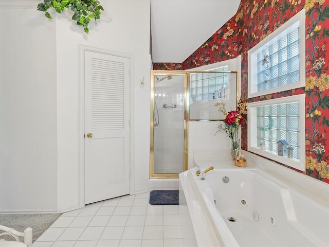 full bath with a stall shower, wallpapered walls, and a wealth of natural light