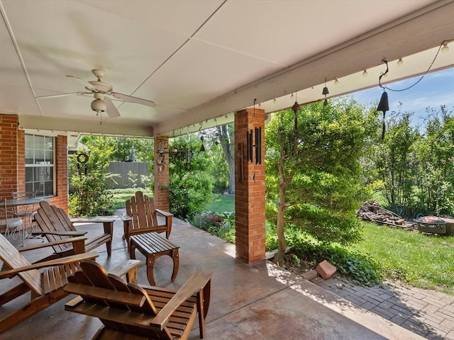 view of patio / terrace featuring ceiling fan and fence