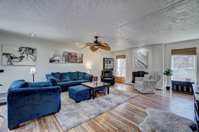 6000 N Pennsylvania Ave Unit 59, Oklahoma City, OK 73112 - living room with a ceiling fan, a textured ceiling, and wood finished floors