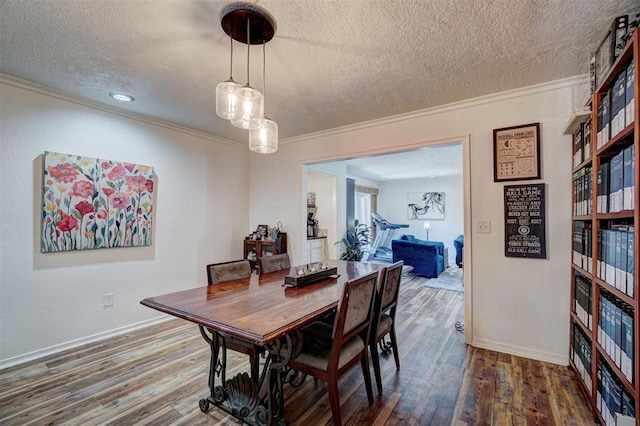 6000 N Pennsylvania Ave Unit 59, Oklahoma City, OK 73112 - dining room with crown molding, a textured ceiling, and wood finished floors