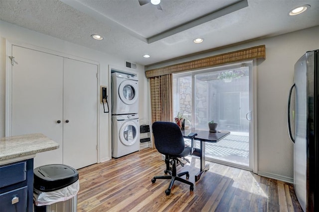 6000 N Pennsylvania Ave Unit 59, Oklahoma City, OK 73112 - office space with visible vents, baseboards, stacked washing maching and dryer, recessed lighting, and light wood-style flooring