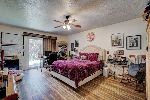 6000 N Pennsylvania Ave Unit 59, Oklahoma City, OK 73112 - bedroom featuring a ceiling fan, a textured ceiling, access to exterior, and wood finished floors