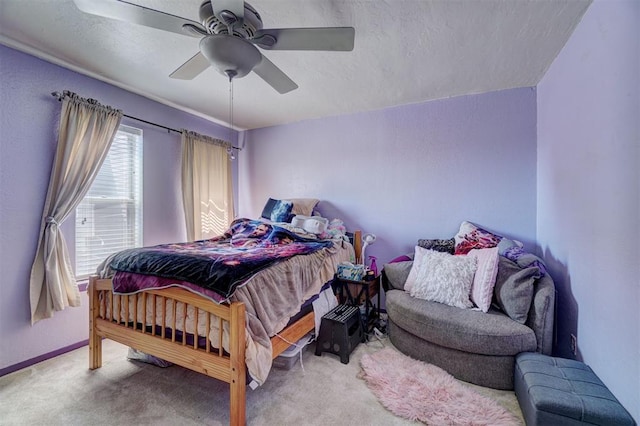 6000 N Pennsylvania Ave Unit 59, Oklahoma City, OK 73112 - carpeted bedroom with baseboards, a textured ceiling, and ceiling fan