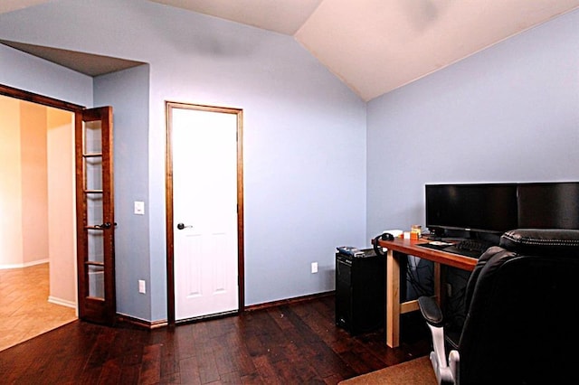 office space with hardwood / wood-style flooring, lofted ceiling, and baseboards