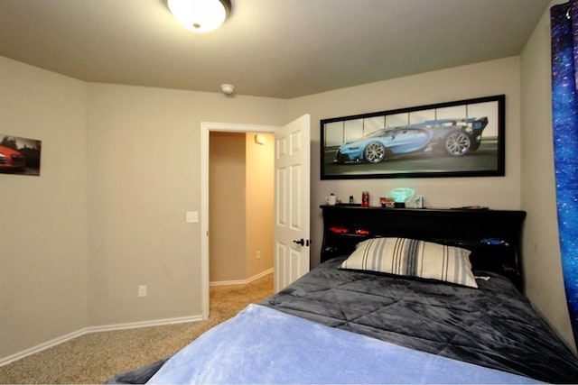 bedroom featuring carpet and baseboards