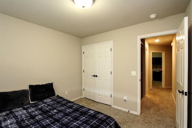 bedroom featuring carpet and baseboards