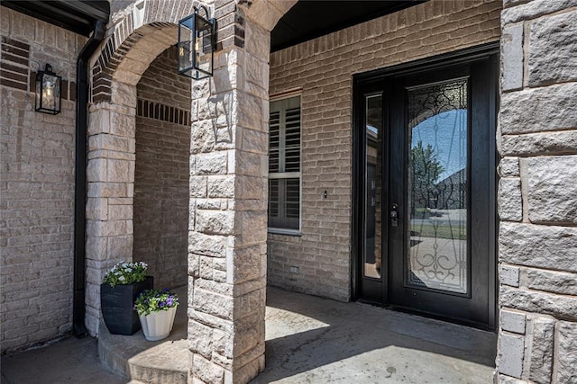 8521 NW 124th St, Oklahoma City, OK 73142 - property entrance featuring stone siding