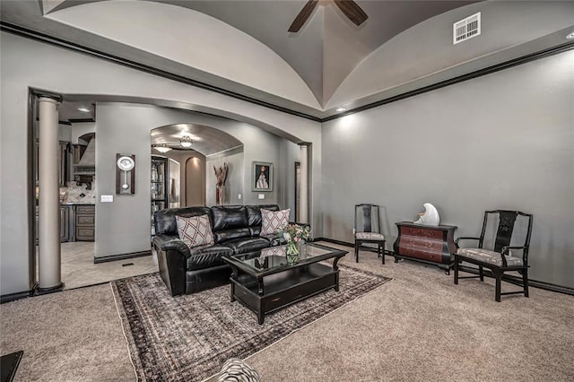 8521 NW 124th St, Oklahoma City, OK 73142 - living area with arched walkways, carpet floors, a ceiling fan, vaulted ceiling, and baseboards