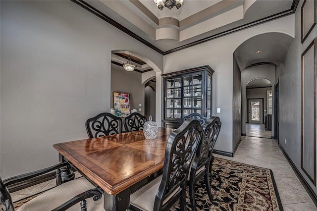 8521 NW 124th St, Oklahoma City, OK 73142 - dining area with arched walkways, ornamental molding, baseboards, and a chandelier