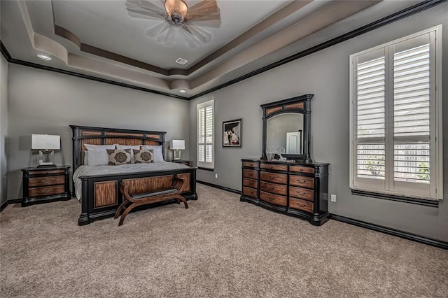 8521 NW 124th St, Oklahoma City, OK 73142 - bedroom featuring carpet floors, baseboards, a tray ceiling, crown molding, and ceiling fan